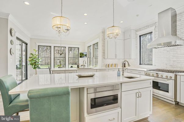 Chandelier, Interior, Kitchen, Pendant Lights, Recessed Lighting, Stainless Steel Appliances, Wood Texture Flooring