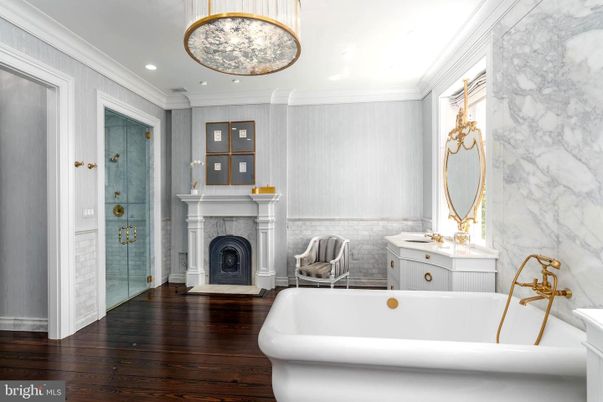 Bathroom, Fireplace, Free Standing Baths, Interior, Marble Walls, Recessed Lighting, Wood Texture Flooring