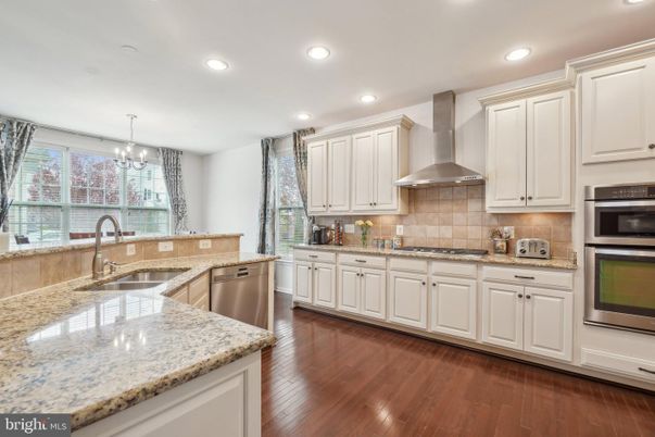 Chandelier, Interior, Kitchen, Recessed Lighting, Stainless Steel Appliances, Wood Texture Flooring