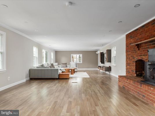 Fireplace, Interior, Living room, Recessed Lighting, Stone Walls, Wood Texture Flooring