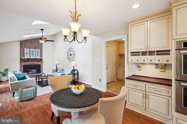 Dining room, Fireplace, Interior, Kitchen, Living room, Pendant Lights, Recessed Lighting, Stainless Steel Appliances, Stone Walls, Wood Texture Flooring
