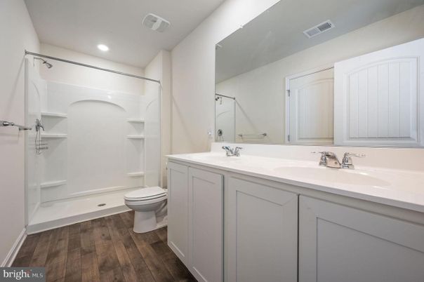 Bathroom, Dual Sink Vanities, Interior, Recessed Lighting, Walk-in Closets, Wood Texture Flooring