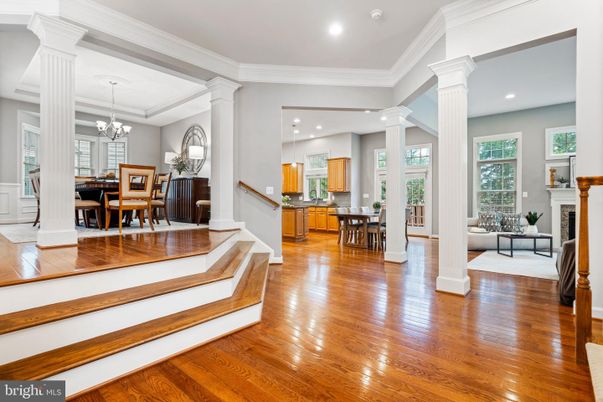 Chandelier, Dining room, Fireplace, Interior, Kitchen, Living room, Recessed Lighting, Wood Texture Flooring
