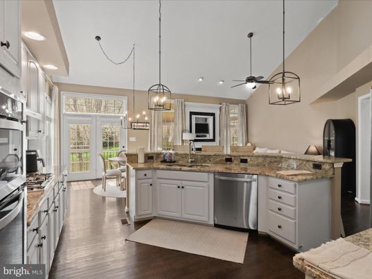 Chandelier, Dining room, Interior, Kitchen, Pendant Lights, Recessed Lighting, Stainless Steel Appliances, Wood Texture Flooring
