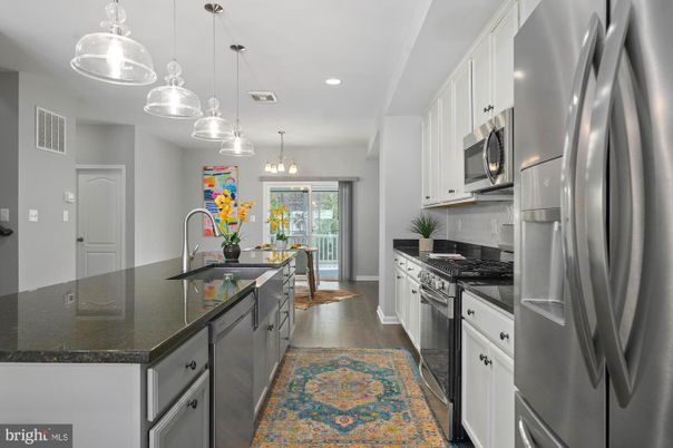 Chandelier, Interior, Kitchen, Pendant Lights, Recessed Lighting, Stainless Steel Appliances, Wood Texture Flooring