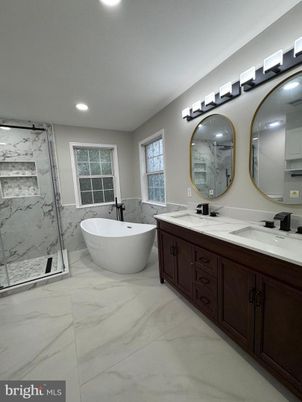 Bathroom, Dual Sink Vanities, Free Standing Baths, Glass Shower, Interior, Marble, Marble Walls, Recessed Lighting
