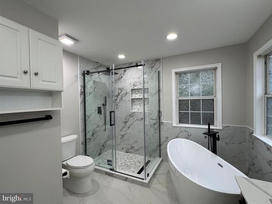 Bathroom, Free Standing Baths, Glass Shower, Interior, Marble, Marble Walls, Recessed Lighting