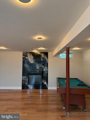 Billiard Table, Fireplace, Game Room, Interior, Recessed Lighting, Wood Texture Flooring