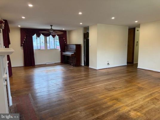 Fireplace, Interior, Piano, Recessed Lighting, Wood Texture Flooring