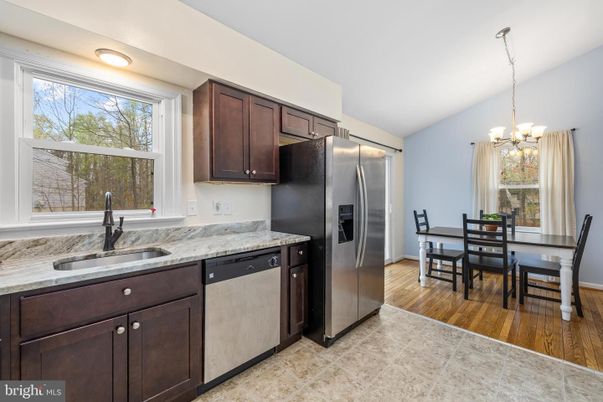 Chandelier, Dining room, Interior, Kitchen, Stainless Steel Appliances, Wood Texture Flooring