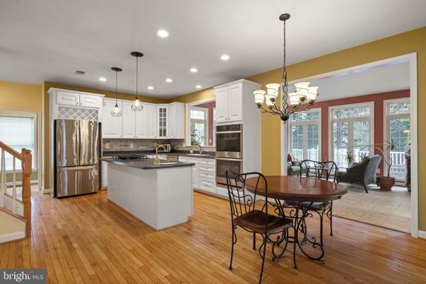 Chandelier, Dining room, Interior, Kitchen, Pendant Lights, Recessed Lighting, Stainless Steel Appliances, Wood Texture Flooring