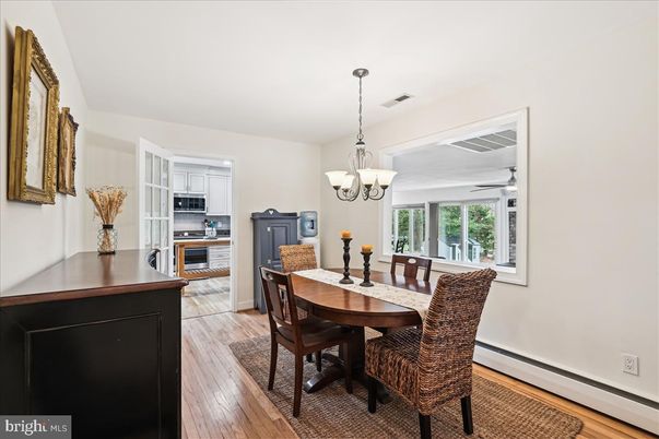 Chandelier, Dining room, Interior, Kitchen, Stainless Steel Appliances, Wood Texture Flooring