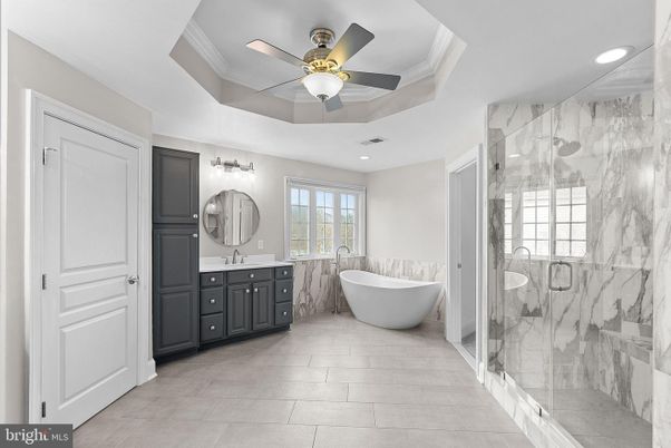 Bathroom, Dual Sink Vanities, Free Standing Baths, Glass Shower, Interior, Marble Walls, Recessed Lighting