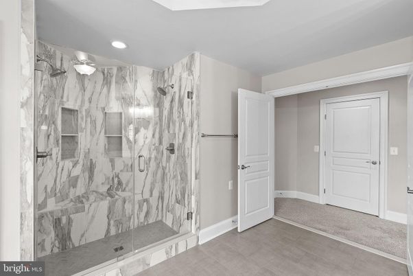 Bathroom, Glass Shower, Interior, Marble Walls, Recessed Lighting, Wood Texture Flooring