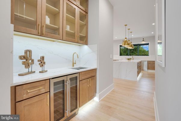 Interior, Kitchen, Marble Walls, Pendant Lights, Recessed Lighting, Stainless Steel Appliances, Wood Texture Flooring