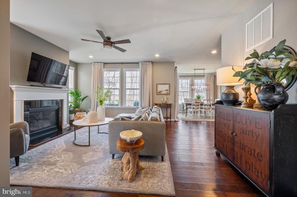 Dining room, Fireplace, Interior, Living room, Recessed Lighting, Wood Texture Flooring