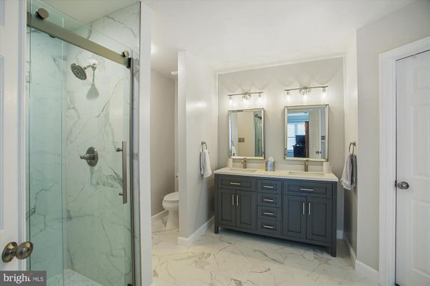 Bathroom, Dual Sink Vanities, Glass Shower, Interior, Marble, Marble Walls