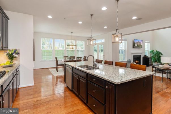 Chandelier, Dining room, Fireplace, Interior, Kitchen, Living room, Pendant Lights, Recessed Lighting, Wood Texture Flooring