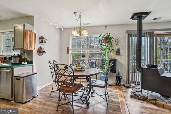 Dining room, Fireplace, Interior, Pendant Lights, Wood Texture Flooring