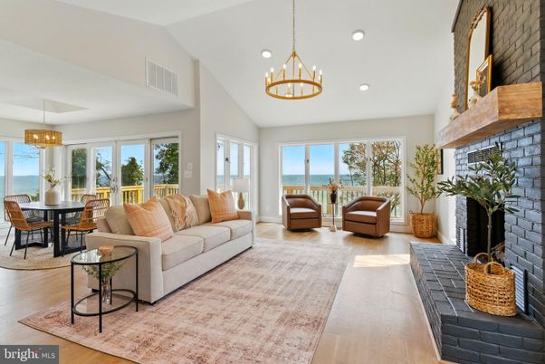 Chandelier, Dining room, Fireplace, Interior, Living room, Pendant Lights, Recessed Lighting, Water, Wood Texture Flooring