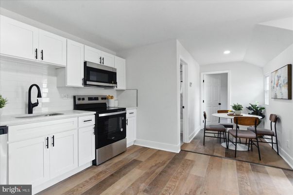 Dining room, Interior, Kitchen, Recessed Lighting, Stainless Steel Appliances, Wood Texture Flooring