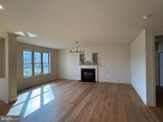 Chandelier, Empty room, Fireplace, Interior, Recessed Lighting, Wood Texture Flooring