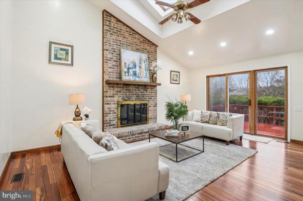 Fireplace, Interior, Living room, Recessed Lighting, Stone Walls, Wood Texture Flooring