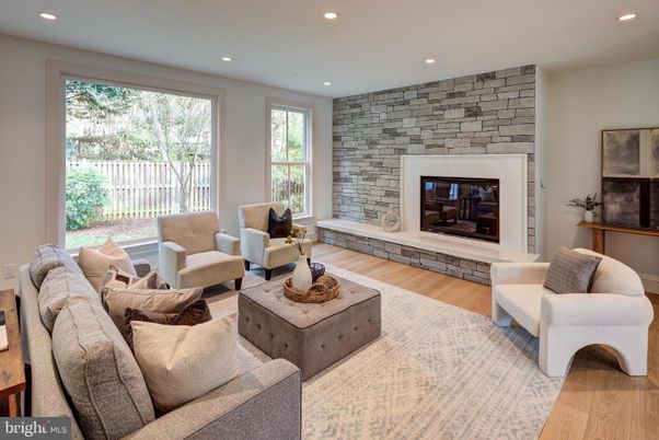 Fireplace, Interior, Living room, Recessed Lighting, Stone Walls, Wood Texture Flooring