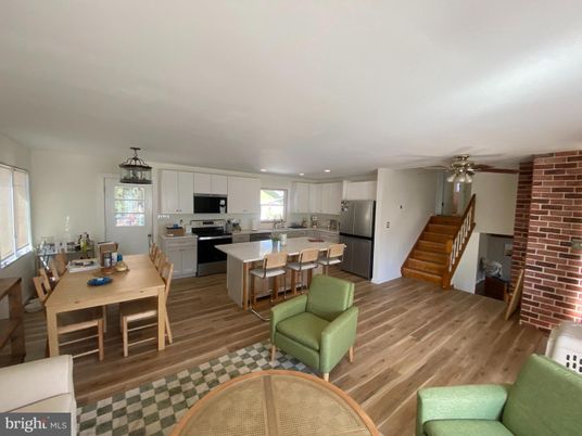 Dining room, Interior, Kitchen, Recessed Lighting, Stainless Steel Appliances, Stone Walls, Wood Texture Flooring