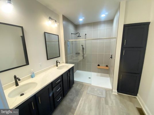 Bathroom, Dual Sink Vanities, Glass Shower, Interior, Recessed Lighting, Wood Texture Flooring