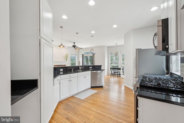 Dining room, Interior, Kitchen, Pendant Lights, Recessed Lighting, Stainless Steel Appliances, Wood Texture Flooring