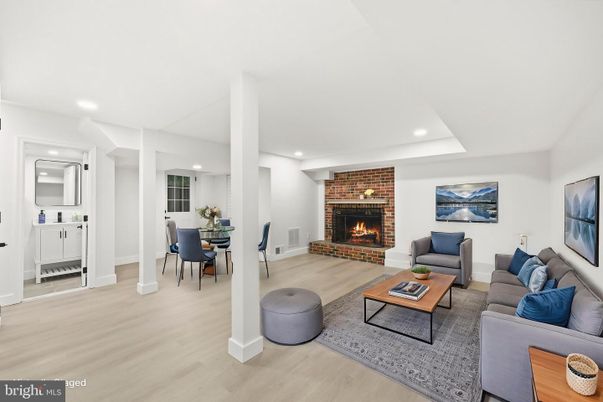 Dining room, Fireplace, Interior, Living room, Recessed Lighting, Stone Walls, Wood Texture Flooring