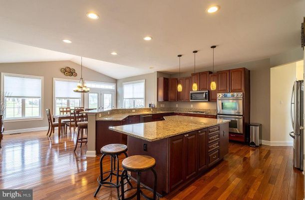 Chandelier, Dining room, Interior, Kitchen, Pendant Lights, Recessed Lighting, Stainless Steel Appliances, Wood Texture Flooring