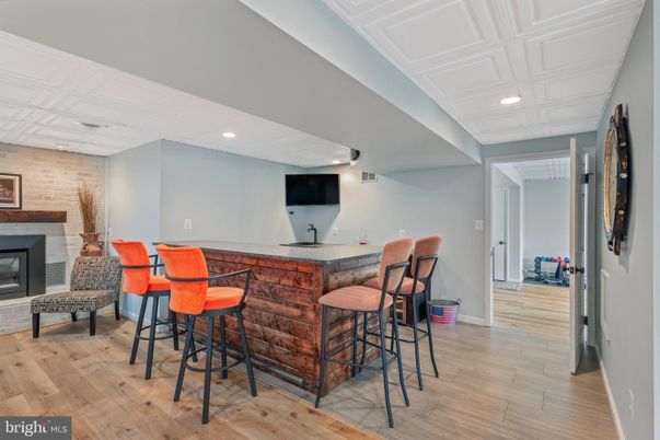 Fireplace, Interior, Recessed Lighting, Stone Walls, Wood Texture Flooring