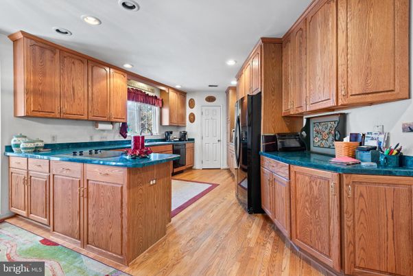 Interior, Kitchen, Recessed Lighting, Tile Countertops, Wood Texture Flooring
