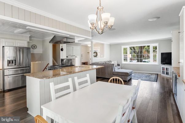 Chandelier, Dining room, Interior, Kitchen, Living room, Stainless Steel Appliances, Wood Texture Flooring