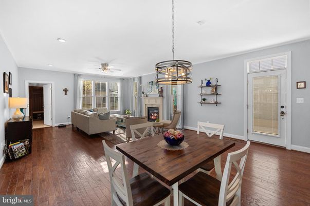 Dining room, Fireplace, Interior, Living room, Pendant Lights, Recessed Lighting, Wood Texture Flooring