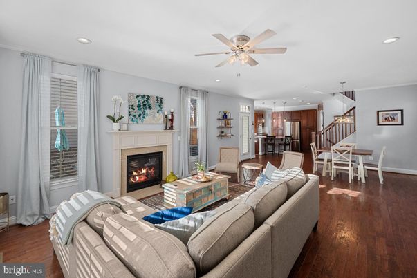 Dining room, Fireplace, Interior, Living room, Pendant Lights, Recessed Lighting, Wood Texture Flooring