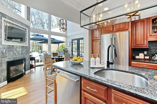 Dining room, Fireplace, Interior, Kitchen, Recessed Lighting, Stainless Steel Appliances, Wood Texture Flooring