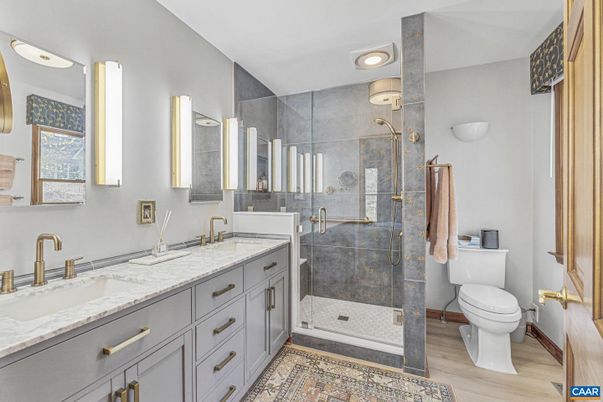 Bathroom, Dual Sink Vanities, Glass Shower, Interior, Recessed Lighting, Wood Texture Flooring
