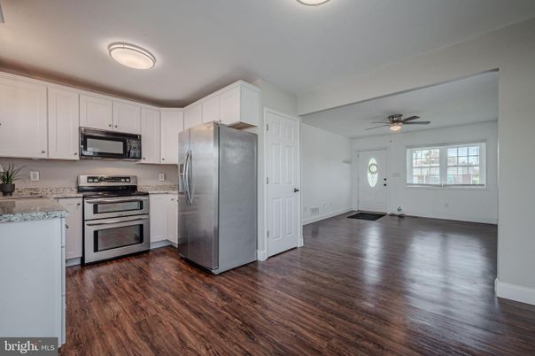 Empty room, Interior, Kitchen, Stainless Steel Appliances, Wood Texture Flooring