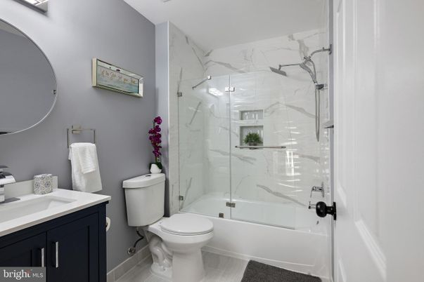 Bathroom, Glass Shower, Interior, Marble Walls, Wood Texture Flooring