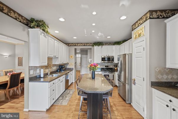 Dining room, Interior, Kitchen, Recessed Lighting, Stainless Steel Appliances, Wood Texture Flooring