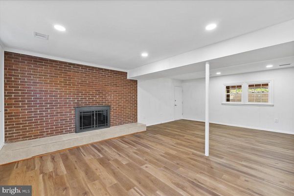 Empty room, Fireplace, Interior, Recessed Lighting, Stone Walls, Wood Texture Flooring