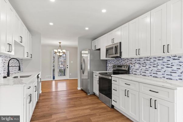 Chandelier, Interior, Kitchen, Recessed Lighting, Stainless Steel Appliances, Wood Texture Flooring