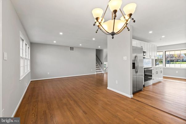 Chandelier, Empty room, Interior, Kitchen, Recessed Lighting, Stainless Steel Appliances, Wood Texture Flooring