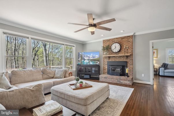 Fireplace, Interior, Living room, Recessed Lighting, Stone Walls, Wood Texture Flooring