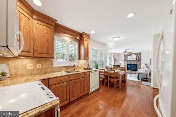 Dining room, Fireplace, Interior, Kitchen, Recessed Lighting, Wood Texture Flooring