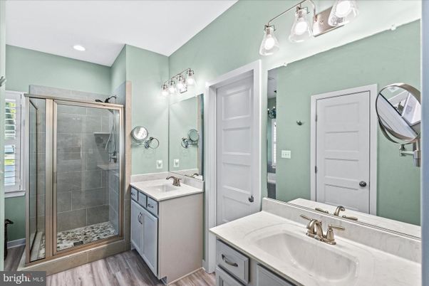 Bathroom, Dual Sink Vanities, Glass Shower, Interior, Recessed Lighting, Wood Texture Flooring