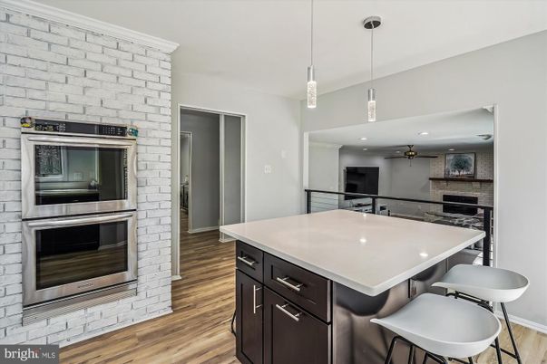 Interior, Kitchen, Pendant Lights, Recessed Lighting, Stainless Steel Appliances, Stone Walls, Wood Texture Flooring